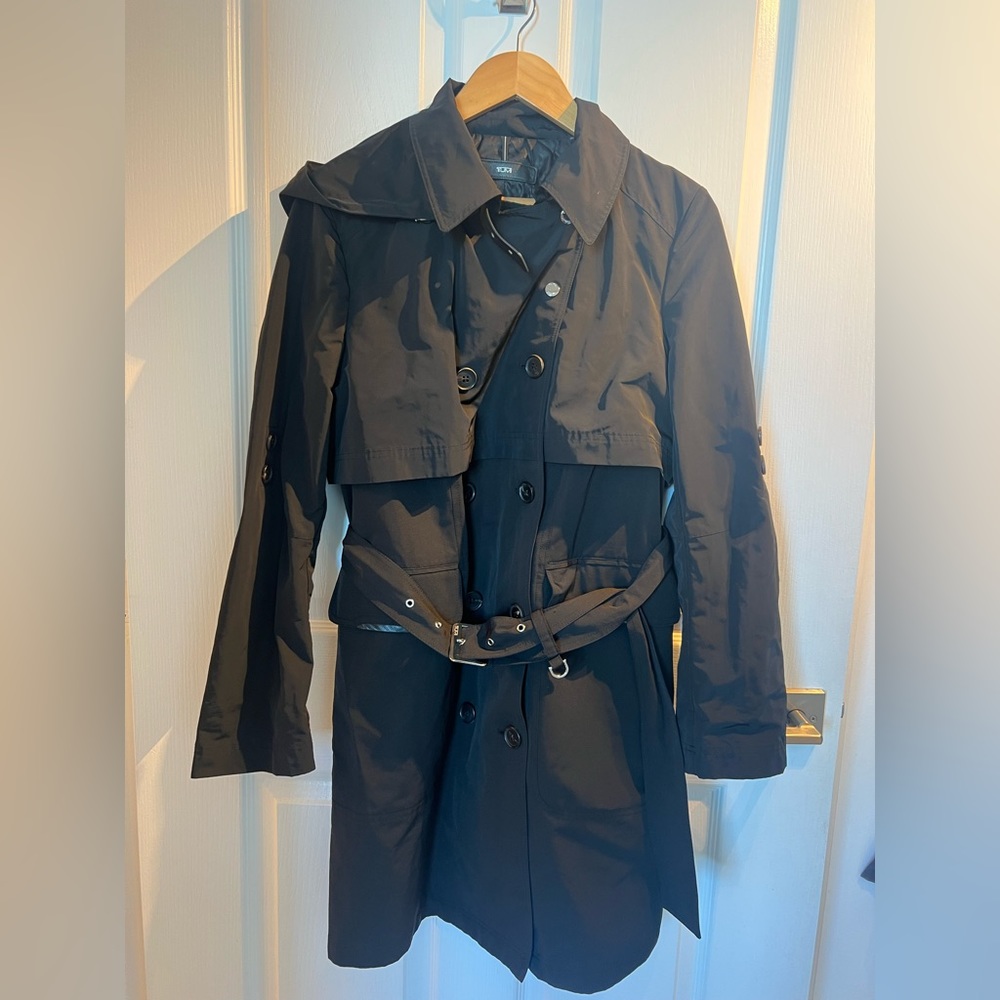 TUMI trench coat size Large. Never used. like new. Pet and smoke free home.